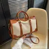 Bolsa de viaje corta de comercio exterior 2026, gran capacidad, bandolera de moda, bolso de mano elegante para ir al trabajo y salidas