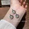 Venta al por mayor del fabricante Colgante de Luna de Jade Azul Natural Xiaohongshu con Incrustación de Plata S925, Diseño Fresco y Delicado