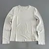 Diseño cosido, suave y cómodo, estilo casual y relajado, camiseta de manga larga para mujer, cuello redondo, color liso, versátil, adelgazante y se puede usar como capa base