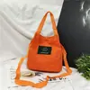 Atacado Primavera e Verão Nova Mochila de Lona Feminina Bolsa de Mão Bolsa Transversal de Ombro Cor Doce Porta-moedas para Celular
