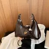 Bolso de mano de diseño de nicho de alta gama de moda nuevo 2026 transfronterizo, nuevo bolso de axila, bolso tipo albóndiga, bolso cruzado para mujer