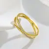 Anillo cruzado de acero de titanio estilo ins europeo y americano al por mayor anillo de acero inoxidable con micro diamantes CNC anillo abierto para hombres y mujeres
