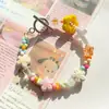 Color flor de cinco pétalos cerámica cuentas sueltas Macaron lindas cuentas perforadas pulsera collar DIY accesorios al por mayor