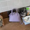 Bolsa Feminina 2026 Nova Tendência Moda Primavera Bolsa de Mão de Alto Valor Bolsa em Formato de Concha para Trabalho e Deslocamento Bolsa de Ombro Transversal