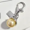 Nuevo Colgante Metálico Rosa Plateado Forma de Corazón Botella de Perfume de Cereza Llavero Accesorio Versátil para Bolsa Venta al por Mayor Dropshipping