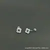 Pendientes de Tachuela de Trébol Hueco con Tornillo de Plata Pura 999 con Diamantes Completos para Mujer, Pendientes Versátiles de Lujo Ligero de Nicho de Gama Alta