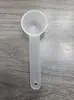 Venta al por mayor de fábrica cuchara medidora de PP con mango largo cuchara medidora de algas cuchara para líquido y polvo plástico de color sólido simple cuchara de fondo redondo