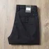 Estación europea verano nailon spandex pantalones de hombre color claro elástico simple versátil fino corte de negocios rectos casuales