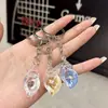 Chaveiro de Pingente de Concha Luminosa Simulada Acrílica Transparente Transfronteiriço para Casal Chaveiro Feminino Joias Atacado