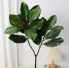 Hojas de magnolia artificiales de PU para decoración de escaparates interiores, hojas artificiales para centros comerciales y arreglos florales de casas de huéspedes, venta al por mayor