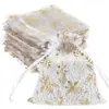 Bolsa de malla con copo de nieve repujado en oro transfronteriza, bolsa para empaquetar dulces navideños, bolsa de regalo para galletas y chocolates, bolsa transparente con cordón