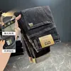 Calça jeans masculina nova de outono 2024, slim fit, pequena, reta, bordada, lavada, coreana, moderna, para todos os gostos, calça de vaca