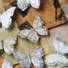Paquete de 3 decoraciones de mariposas de plumas, con clips de mariposa realistas y tridimensionales, con brillo dorado reluciente, perfectas para decoraciones de Navidad