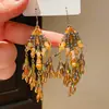 Estilo Étnico Retro Gancho de Oreja con Borla Colorida de Cuentas de Cristal Pendientes Exagerados de Nicho Europeos y Americanos Pendientes Elegantes y de Alta Gama