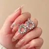 Brincos da Moda Estilo Coreano Mais Vendidos Novo Modelo Brincos Femininos Simples e Elegantes Versáteis Tiktok Mesmo Estilo Tarraxas Atacado