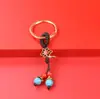 Se puede hacer tú mismo con cuerda roja creativa, cinco monedas de emperador, accesorios semiacabados para llaveros, accesorios para bolsos, colgante para coche, generación