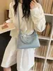 Bolsa Pequena Versátil de Alta Qualidade para Travessia de Fronteira de Grande Capacidade Novo Estilo Primavera 2026 Bolsa de Ombro Único para Sobrancelha Feminina Bolsa Transversal Tipo Bolinho
