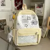 Mochila de estilo coreano con parche de estrella amarillo crema vibrante para estudiantes de secundaria, dulce y rejuvenecedora, mismo estilo que usan las mejores amigas para salir