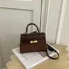 Bolso de mano de nicho de alta gama transfronterizo bolso Kelly para mujer 2026 nuevo bolso de hombro de moda bolso cruzado casual para el día a día para mujer