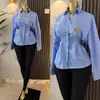 Roupas femininas transfronteiriças europeias e americanas outono 2026 novo design moderno elegante com gola acinturado top de camisa listrada para mulheres