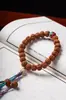 Pulsera Personalizada de Platillo Volador Rey del Árbol Semilla Rudraksha Bodhi Borla Portátil Cinco Pétalos Doble Dragón Cabeza Plana Piel Amarilla y Roja Cuentas de Buda Explosivas