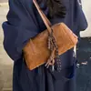 Bolsa de mão simples, camurça, estilo outono coreano, bolsa de ombro, vintage, elegante, versátil, design novo, adequada para o dia a dia, feminina, 2026