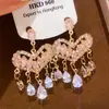 Pendientes de Flor de Perla con Circonita Incrustada de Diamantes de Lujo, Pendientes de Moda de Lujo Ligero y Gama Alta, Pendientes de Estilo Europeo y Americano con un Diseño de Nicho