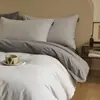 Juego de ropa de cama de cuatro piezas de algodón cepillado de color sólido estilo minimalista, funda de edredón de algodón puro, sábana, juego de ropa de cama de tres piezas para dormitorio