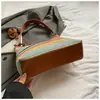 Bolso de axila tejido con paja más vendido transfronterizo, bolso de hombro estilo vacacional, bolso de mujer de moda a rayas bohemio, al por mayor