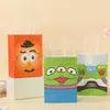 Nuevas bolsas de papel kraft de colores de dibujos animados populares, bolsos creativos, bolsas de regalo de papel, bolsas de compras al por mayor
