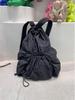 Mochila da moda prática grande capacidade cordão design nicho casual leve lavável mochila de tecido para homens e mulheres
