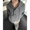 Suéter casual y relajado de estilo coreano con media botonadura para hombre, simple y versátil, con diseño de capucha y tejido de punto de color liso