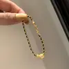 Anillo Corredor Dorado de Explosiones de Libro de Caperucita Roja Pulsera de Oro Negro Cadena Estilo Chanel Simple y a la Moda para Mujer Cuerda de Mano Trenzada Flash Cepillada