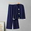 Conjunto europeo de dos piezas de moda casual transfronteriza para mujer, versátil para otoño e invierno, conjunto de cárdigan de punto con hebilla metálica y pantalones de pierna ancha