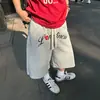 Primavera/Verão 2026 Calça Curta Camuflada Bordada com Letras Estilo Retrô Americano Cordão Unissex Solta Perna Larga Perna Reta Shorts