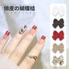 Joyería de uñas con lazo rojo mini roja en línea japonesa al por mayor diy punta del dedo aleación pequeños accesorios decoración de uñas