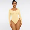 Mono de manga larga ajustado con cuello en V sin costuras para moldear el cuerpo, de gran elasticidad en la cintura y el abdomen, para mujer, con botones ocultos y estilo en T, súper vendido transfronterizo