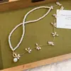 Nuevo collar de perlas asimétrico con borla de cuentas de doble capa, cadena para la clavícula de nicho de alta gama, gargantilla de moda y versátil para mujer