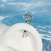 Pendientes de botón únicos de acero de titanio de alta hélice con forma de corazón y alas, con incrustaciones de diamantes de imitación