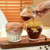 Taza de vidrio popular para café latte, taza regordeta apilable, taza de vidrio minimalista de nicho para leche y bebidas frías