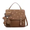 Yaozi 2026 principios de otoño nueva moda mochila simple para mujer bolsa escolar para estudiante bolso de hombro cruzado versátil y elegante