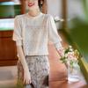 Tejido de punto de manga corta abullonada 2025 Verano Nuevo Estilo Moda Femenina Patrón Acolchado Estéreo Recorte Top de Cuello Redondo