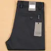 Pantalones de hombre de ajuste recto y slim, de color liso grueso, fibra de poliéster suave y algodón elástico, para otoño e invierno 2021, de negocios casual