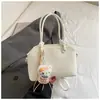 Bolso de mujer de alta gama de nicho 2026 nueva versión coreana bolso de hombro cruzado simple y elegante bolso de mano de gran capacidad moderno