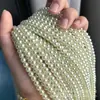 Venta al por mayor de fábrica de cuentas redondas de color verde lechoso, perforadas, de imitación de perla Swarovski, de alto brillo, para agujero recto, accesorios para joyería DIY, cuentas sueltas al por mayor