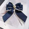 Moda Nueva Cinta de Satén Colgante de Perla Lazo Accesorio para Cuello Elegante Moda Chica Pajarita Broche