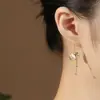 Aretes de bolsa de la suerte de piedra ojo de gato sintético para mujer, aretes de borla de moneda estilo chino de lujo ligero, aretes de calcita anti moda temperamento