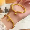 Pulseira Estrela Disco com Contas Marteladas Olho de Gato Banhada a Ouro Brilhante para Mulheres com Anel Corrente Correndo Cravejado de Diamantes e Fio Elástico