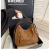 Mochila de un solo hombro y doble hombro para mujer, nuevo modelo otoño 2026, bolsa de axila popular para el día a día, mochila para estudiantes universitarios, bolsa tote