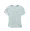 Verão 2026 Novo Estilo Americano Menina Apimentada Ajuste ao Corpo Curto Gola Redonda Top Kardashian Poá Ombro Normal Manga Curta Camiseta para Mulheres
